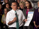 Mitt Romney holds a flier titled "Women & The Obama Economy" as he speaks in Hartford, Conn., Wednesday Mitt Romney holds a flier titled "Women & The Obama Economy" as he speaks in Hartford, Conn., Wednesday