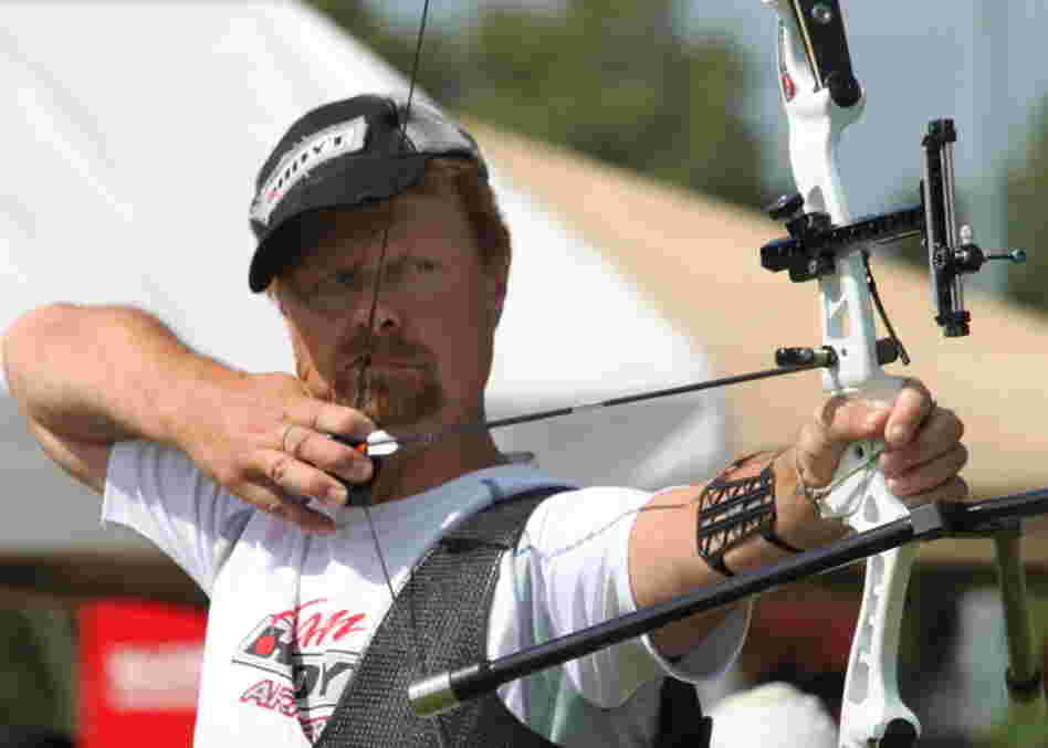Butch Johnson competes in the 2010 U.S. National Target Championships in Hamilton, Ohio. Johnson is trying for his sixth Olympic Games this summer. When not competing, he manages an archery range in Connecticut. He keeps his Olympic medals under the kitchen sink. 