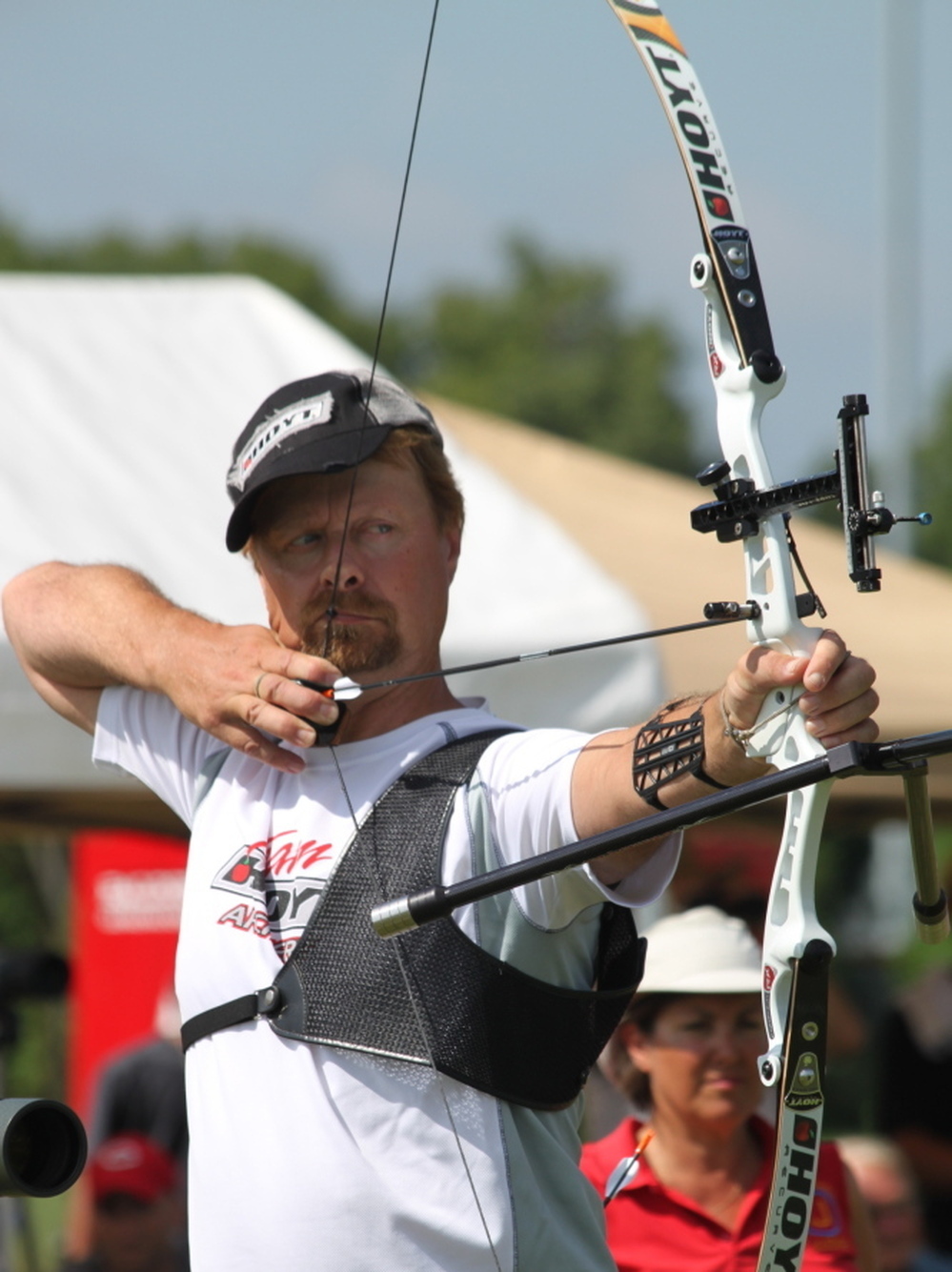 Butch Johnson competes in the 2010 U.S. National Target Championships in Hamilton, Ohio. Johnson is trying for his sixth Olympic Games this summer. When not competing, he manages an archery range in Connecticut. He keeps his Olympic medals under the kitchen sink. 