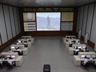 North Korea technicians watch live images of the rocket fueling at the satellite control room of the space center near Pyongyang. North Korea technicians watch live images of the rocket fueling at the satellite control room of the space center near Pyongyang.