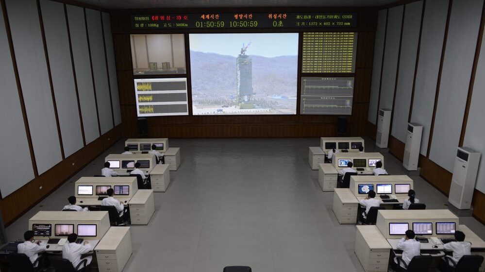 North Korea technicians watch live images of the rocket fueling at the satellite control room of the space center near Pyongyang.