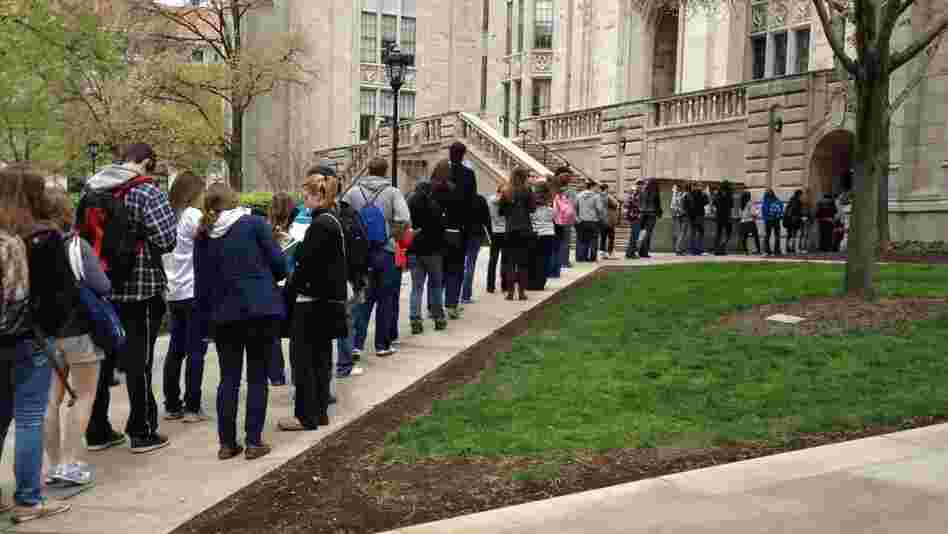 Students wait to pass through a security checkpoint at the University of Pittsburgh's Cathedral of Learning on Tuesday. Security has tightened at the school after a string of false bomb threats on the campus. Students wait to pass through a security checkpoint at the University of Pittsburgh's Cathedral of Learning on Tuesday. Security has tightened at the school after a string of false bomb threats on the campus.