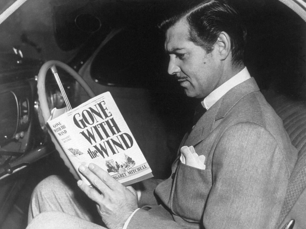 Margaret Mitchell's Gone with the Wind was at the center of Depression-era price-fixing controversies. Here, Clark Gable prepares for his role as Rhett Butler in the MGM film adaptation.