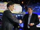 Running mates? Mitt Romney greets former Gov. Mike Huckabee after taking part in a Republican presidential forum on Huckabee's Fox News program on Dec. 3, 2011.