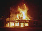 A store burns during the Los Angeles riots in April 1992. Three colleagues at a local radio station watched the riots from their studio on Crenshaw Boulevard, as listeners called in to share their own stories. A store burns during the Los Angeles riots in April 1992. Three colleagues at a local radio station watched the riots from their studio on Crenshaw Boulevard, as listeners called in to share their own stories.