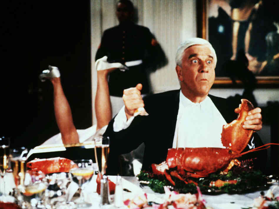 Leslie Nielsen takes a bite out of crime in Naked Gun 2 1/2 — The Smell Of Fear. Leslie Nielsen takes a bite out of crime in Naked Gun 2 1/2 — The Smell Of Fear.