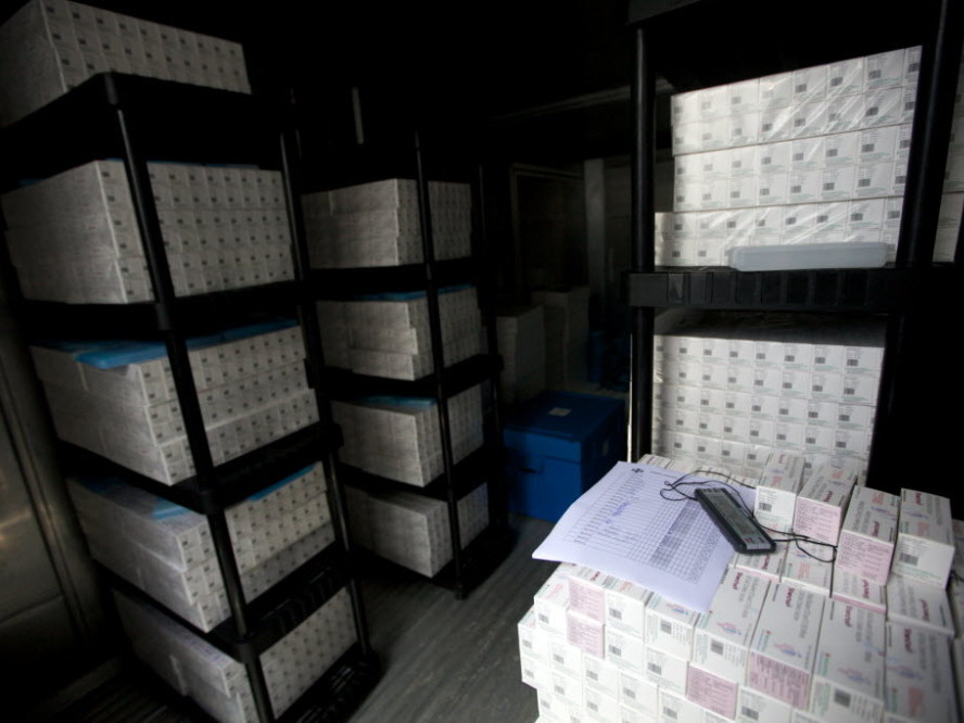 Thousands of doses of cholera vaccine sit in a refrigerated trailer in a United Nations compound in Saint-Marc, Haiti.  