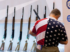 Chris Patrie looks at the Benelli display of shotguns during the NRA annual meetings and exhibits Friday in St. Louis. Chris Patrie looks at the Benelli display of shotguns during the NRA annual meetings and exhibits Friday in St. Louis.