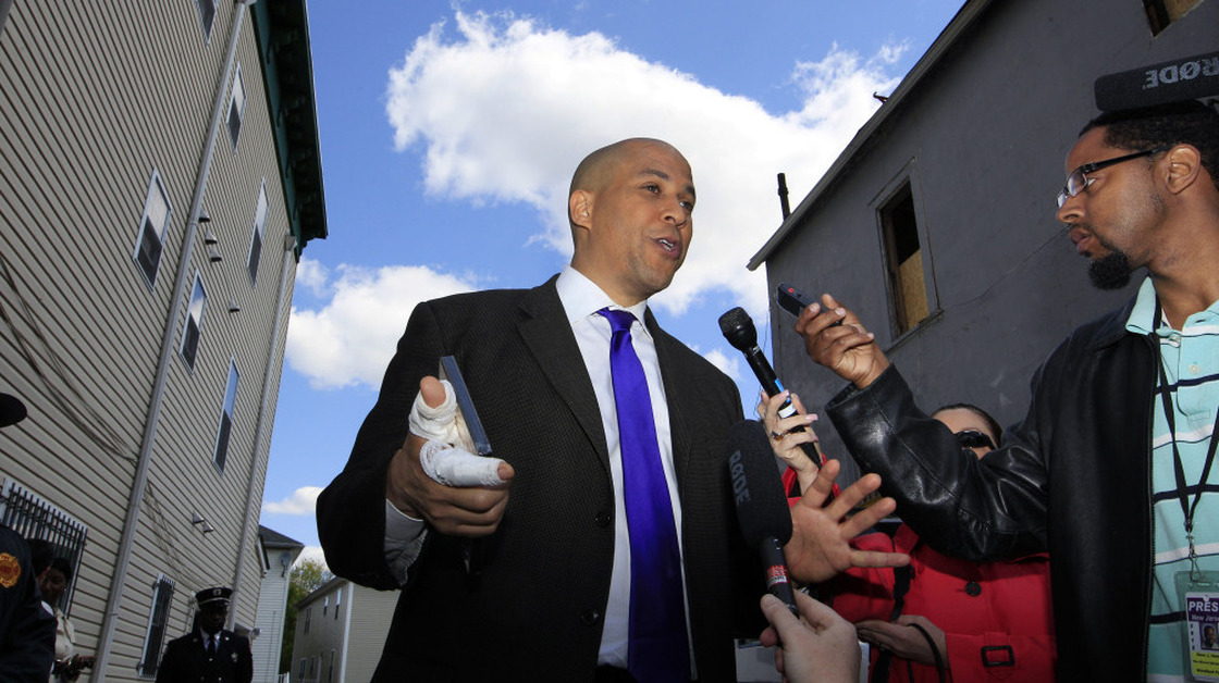 Newark Mayor Cory Booker said he did what anyone would do in rescuing a neighbor Thursday night from a fire at her home. 