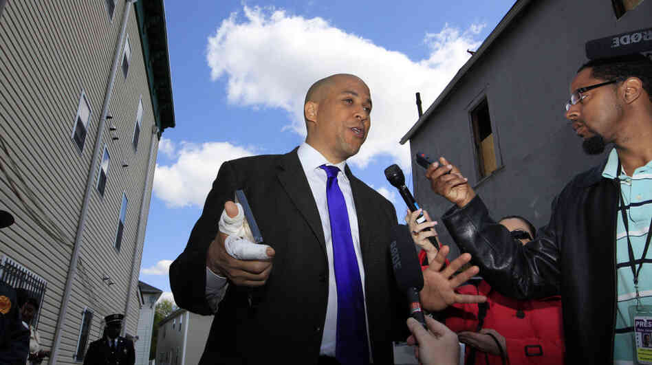 Newark Mayor Cory Booker said he did what anyone would do in rescuing a neighbor Thursday night from a fire at her home. 