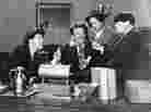 Shemp Howard (at left) is seen in an undated studio handout photo with actor Emil Sitka (second from left) and the other two then-Stooges, Larry Fine and Moe Howard. 