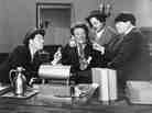 Shemp Howard (at left) is seen in an undated studio handout photo with actor Emil Sitka (second from left) and the other two then-Stooges, Larry Fine and Moe Howard. 