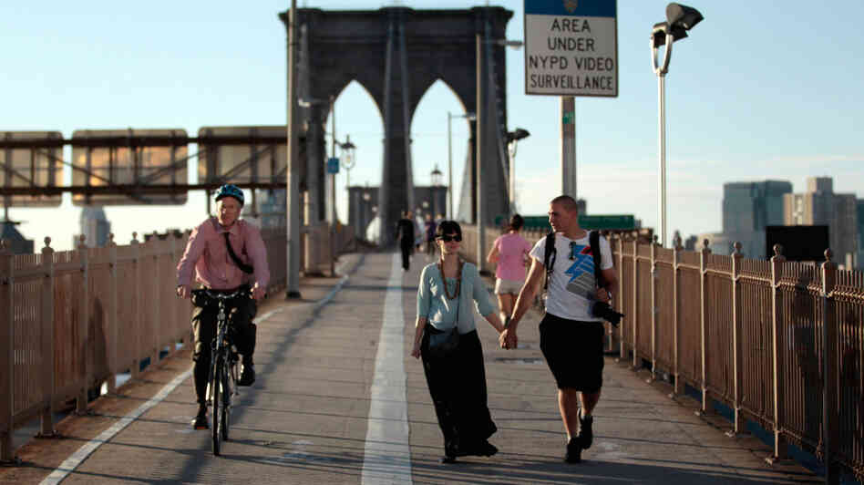 Americans walk less than the citizens of any other industrialized nation, says Tom Vanderbilt. In this file photo from last summer, pedestrians and a cyclist cross the Brooklyn Bridge in New York City. Americans walk less than the citizens of any other industrialized nation, says Tom Vanderbilt. In this file photo from last summer, pedestrians and a cyclist cross the Brooklyn Bridge in New York City.