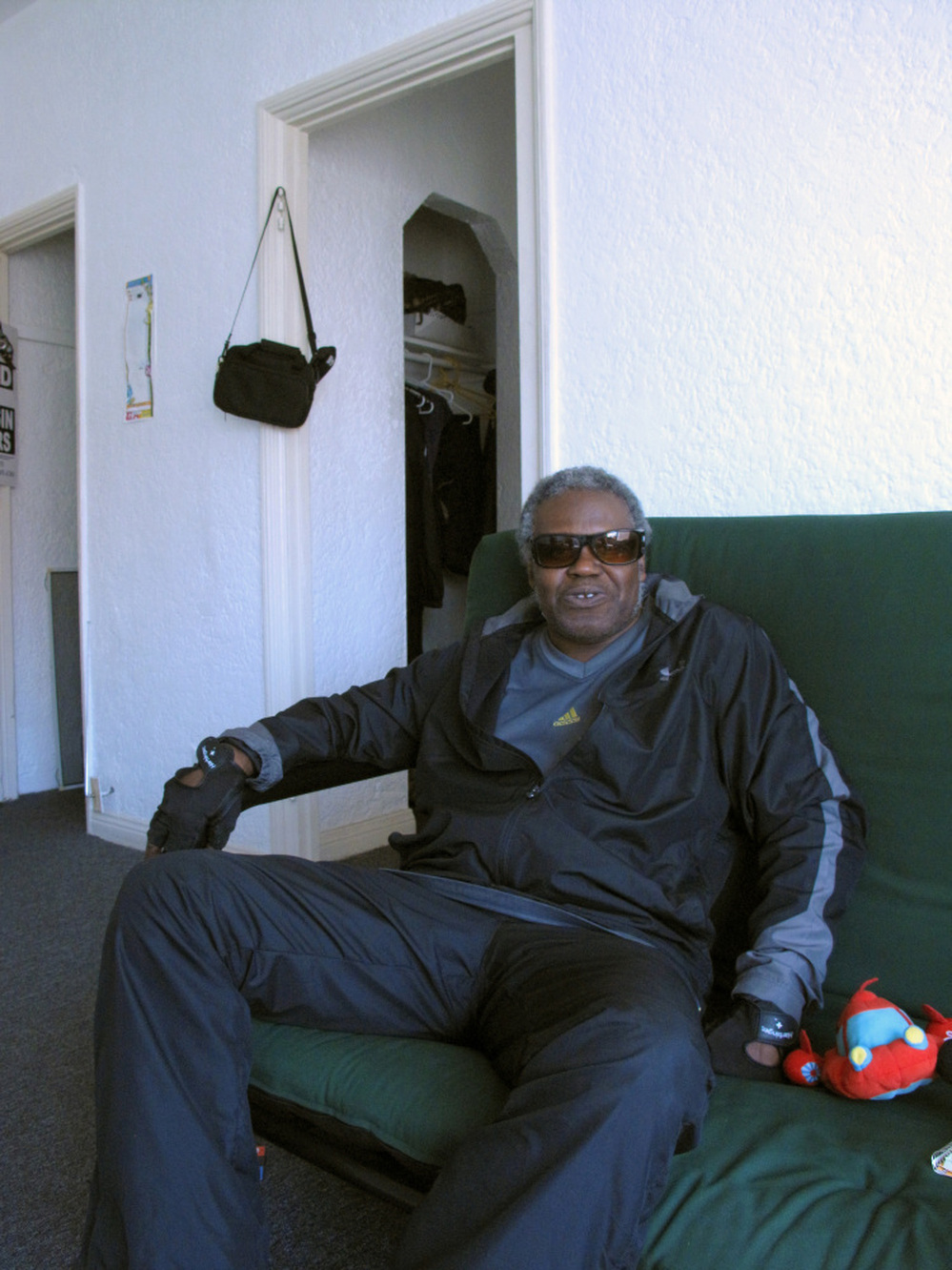 Veteran James Brown relaxes in his apartment, which he recently moved into after spending decades on the streets.