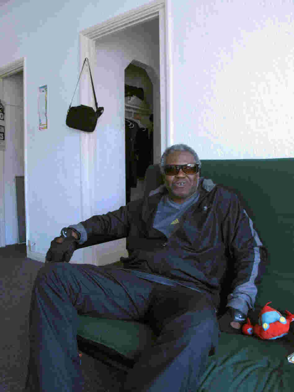 Veteran James Brown relaxes in his apartment, which he recently moved into after spending decades on the streets.