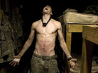 Specialist Tad Donoho screams with pain after being administered a "pink belly" for his birthday: Each member of the platoon struck his stomach until it bruised. July 2008. Specialist Tad Donoho screams with pain after being administered a "pink belly" for his birthday: Each member of the platoon struck his stomach until it bruised. July 2008.