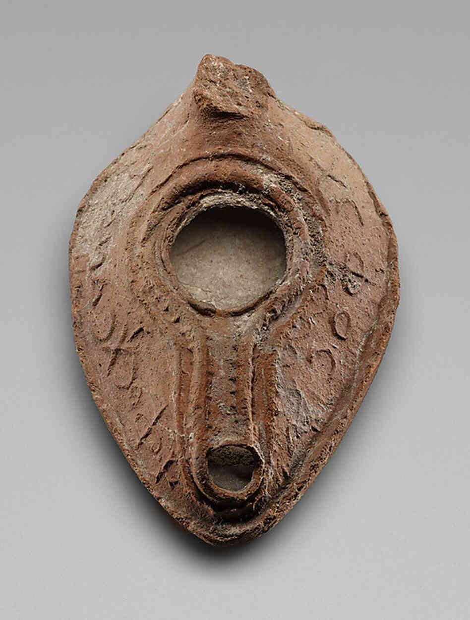An 8th-century oil lamp with a Christian phrase in Greek and Muslim blessings in Arabic now on display at the Metropolitan Museum. An 8th-century oil lamp with a Christian phrase in Greek and Muslim blessings in Arabic now on display at the Metropolitan Museum.