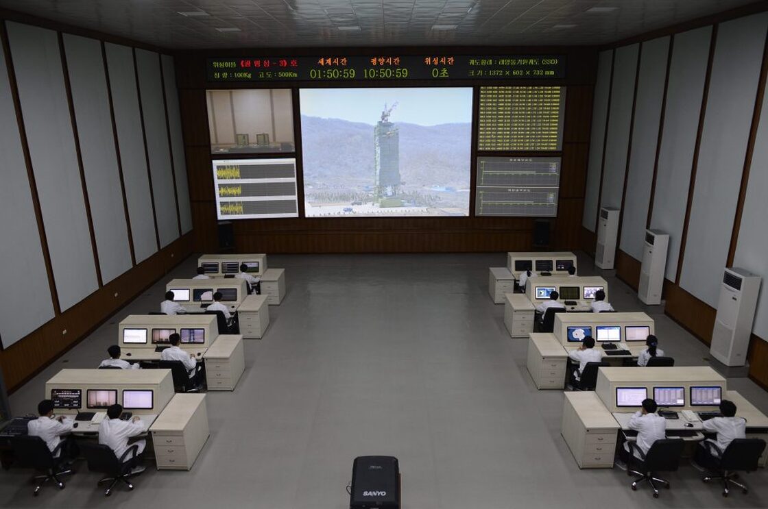 North Korean technicians watch live images of the rocket Unah-3 at the satellite control room of the space center on the outskirts of Pyongyang on Wednesday.