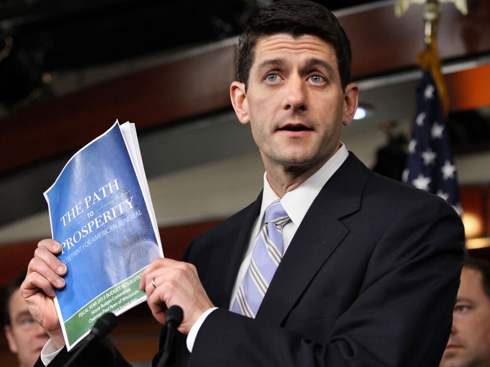 House Budget Committee Chairman Rep. Paul Ryan, R-Wis., with his 2012 budget plan. Ryan cites his Catholic faith in justifying his proposed cuts to social safety-net programs. 