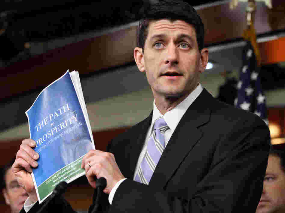 House Budget Committee Chairman Rep. Paul Ryan, R-Wis., with his 2012 budget plan. Ryan cites his Catholic faith in justifying his proposed cuts to social safety-net programs. 