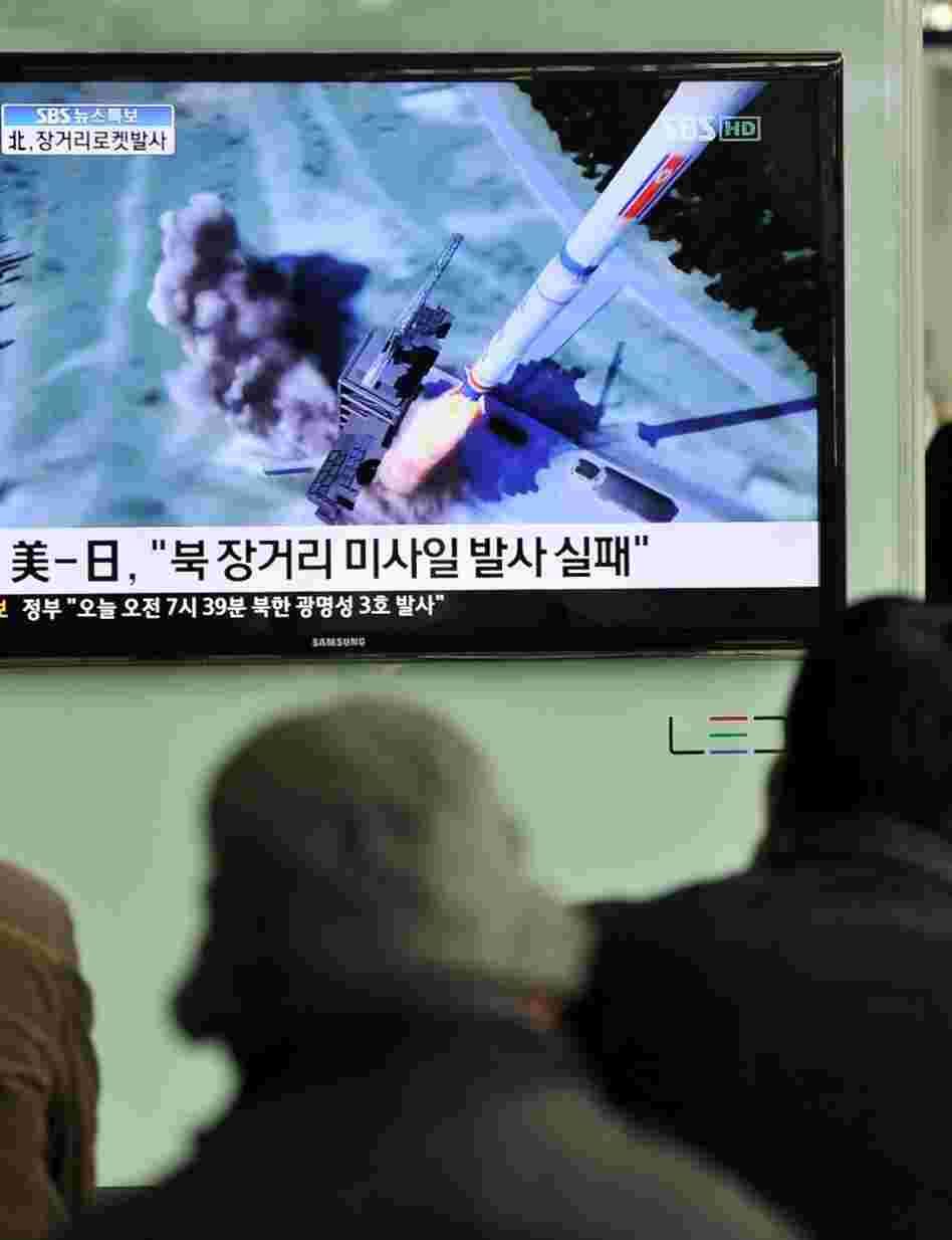 South Koreans watch a TV showing a graphic of North Korea's rocket launch at a train station in Seoul on Friday. South Koreans watch a TV showing a graphic of North Korea's rocket launch at a train station in Seoul on Friday.