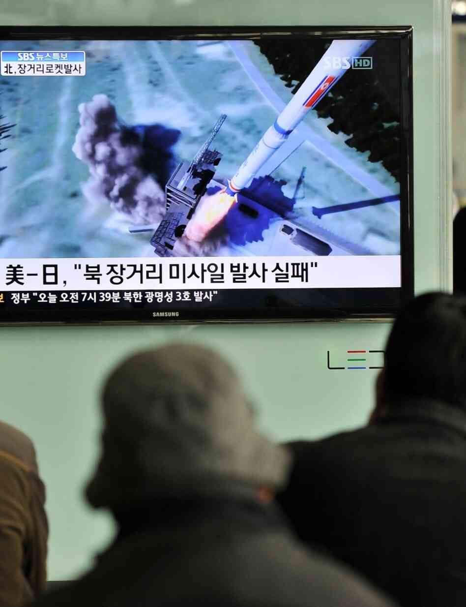 South Koreans watch a TV showing a graphic of North Korea's rocket launch at a train station in Seoul on Friday. South Koreans watch a TV showing a graphic of North Korea's rocket launch at a train station in Seoul on Friday.