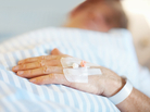 Patient lying on a bed. Patient lying on a bed.