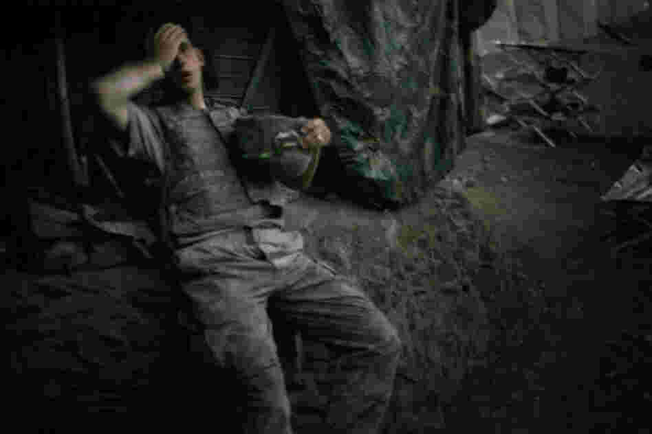 July 2007: A soldier from 2nd Platoon rests at the end of a day of heavy fighting at the Restrepo outpost.