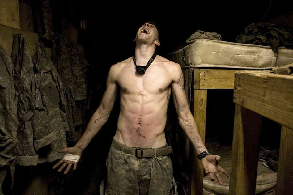 2007: Spc. Tad Donoho screams after being administered a "pink belly" for his birthday: Each member of the platoon strikes his stomach until it begins to bruise.