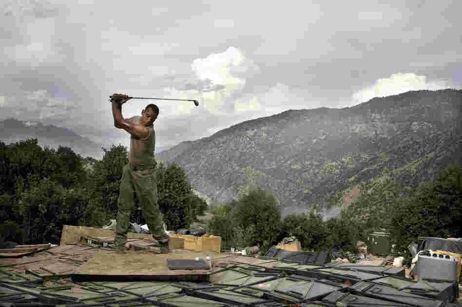 April 2008: Sterling Jones practices his golf swing. Soldiers spend about two weeks at the Restrepo outpost before returning to the main base, where they can get a hot shower and call their families. The outpost was named after 2nd Platoon medic Juan Restrepo, who was killed by insurgents.