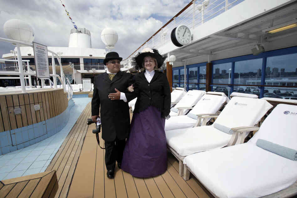Laurie and Dan Castaneda from Long Beach, Calif., walk the pool deck of the Azamara Journey on a Titanic Memorial Cruise. Preparation for their costumes involved several weeks of research, last-minute purchases and even home-sewn clothing from vintage patterns. Laurie and Dan Castaneda from Long Beach, Calif., walk the pool deck of the Azamara Journey on a Titanic Memorial Cruise. Preparation for their costumes involved several weeks of research, last-minute purchases and even home-sewn clothing from vintage patterns.
