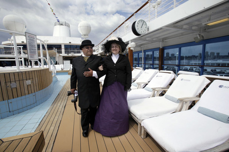 Laurie and Dan Castaneda from Long Beach, Calif., walk the pool deck of the Azamara Journey on a Titanic Memorial Cruise. Preparation for their costumes involved several weeks of research, last-minute purchases and even home-sewn clothing from vintage patterns. Laurie and Dan Castaneda from Long Beach, Calif., walk the pool deck of the Azamara Journey on a Titanic Memorial Cruise. Preparation for their costumes involved several weeks of research, last-minute purchases and even home-sewn clothing from vintage patterns.
