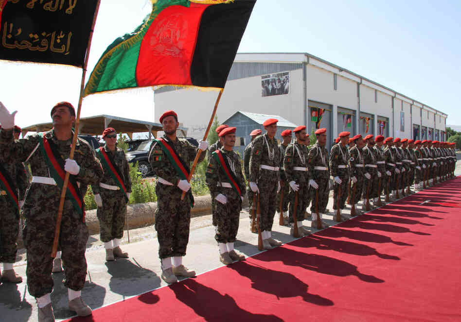 Afghan Army soldiers stand during a security transition ceremony in Mazar-e-Sharif, north of Kabul, Afghanistan, on July 23, 2011. The Afghan government officially took control of security in the capital of the peaceful northern province of Balkh on July 23, as part of an effort to begin handing over all security responsibilities to Afghan forces by 2014. Afghan Army soldiers stand during a security transition ceremony in Mazar-e-Sharif, north of Kabul, Afghanistan, on July 23, 2011. The Afghan government officially took control of security in the capital of the peaceful northern province of Balkh on July 23, as part of an effort to begin handing over all security responsibilities to Afghan forces by 2014.