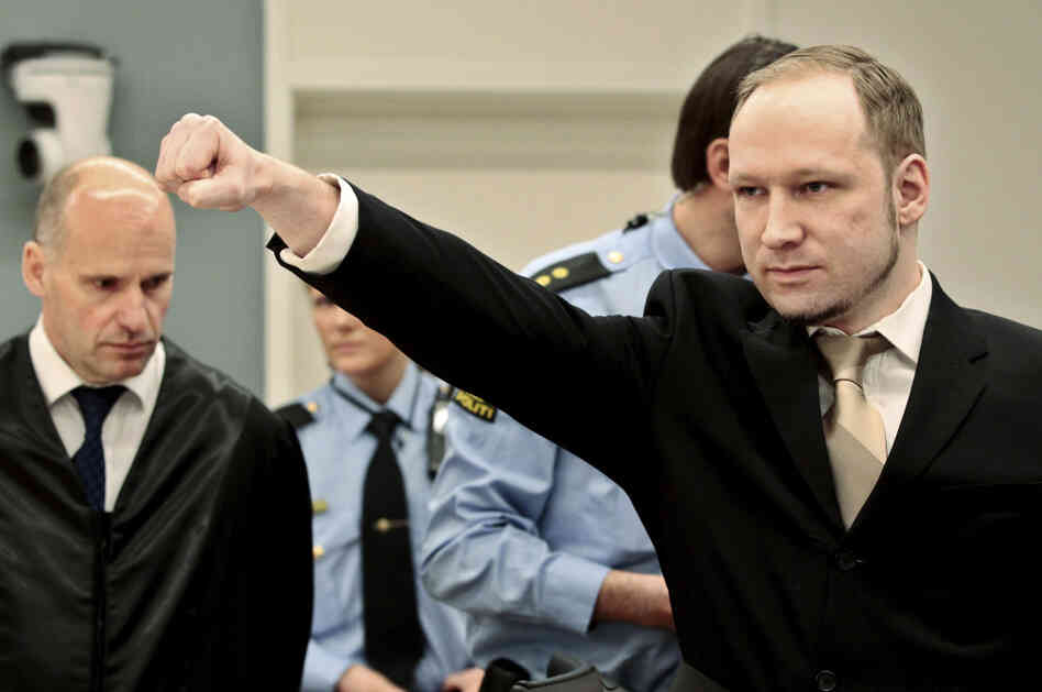 Anders Behring Breivik gestures as he arrives at the courtroom Monday in Oslo, Norway. The terrorism trial against the anti-Muslim fanatic who confessed to killing 77 people starts amid worries that he will use the proceedings to showcase his radical views.