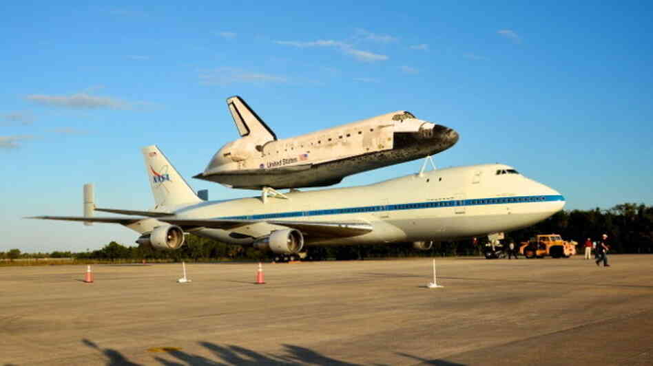 Discovery is sitting atop NASA's 747 Shuttle Carrier Aircraft, which will fly the shuttle from Florida to Virginia.