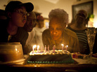 Ida Christian, who suffers from dementia, gets help from her granddaughter, Yolanda Hunter (left), in blowing out the candles on her birthday cake. Yolanda quit her lucrative job to become Ida's full-time caregiver. Ida Christian, who suffers from dementia, gets help from her granddaughter, Yolanda Hunter (left), in blowing out the candles on her birthday cake. Yolanda quit her lucrative job to become Ida's full-time caregiver.