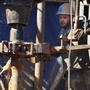 Oil field workers drill into the Gypsum Hills near Medicine Lodge, Kan. Hydraulic fracturing, or "fracking," to coax out oil and gas has led to a natural gas boom that the U.S. market is having trouble absorbing.