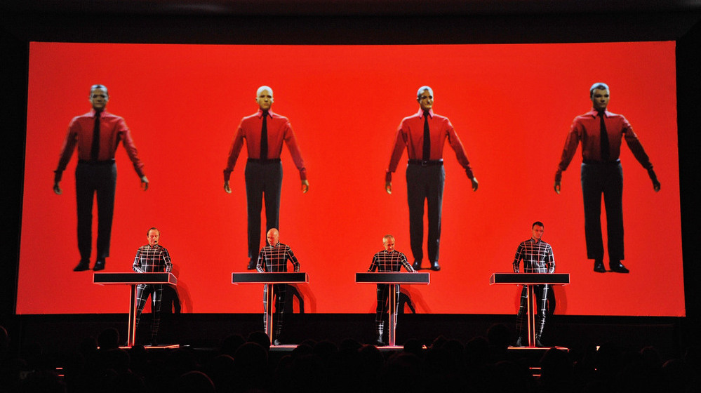 Robots: Ralf Hutter, Henning Schmitz, Fritz Hilpert, and Stefan Pfaffe of the band Kraftwerk perform during the Kraftwerk — Retrospective 1 2 3 4 5 6 7 8 at The Museum of Modern Art on April 10, 2012 in New York City.