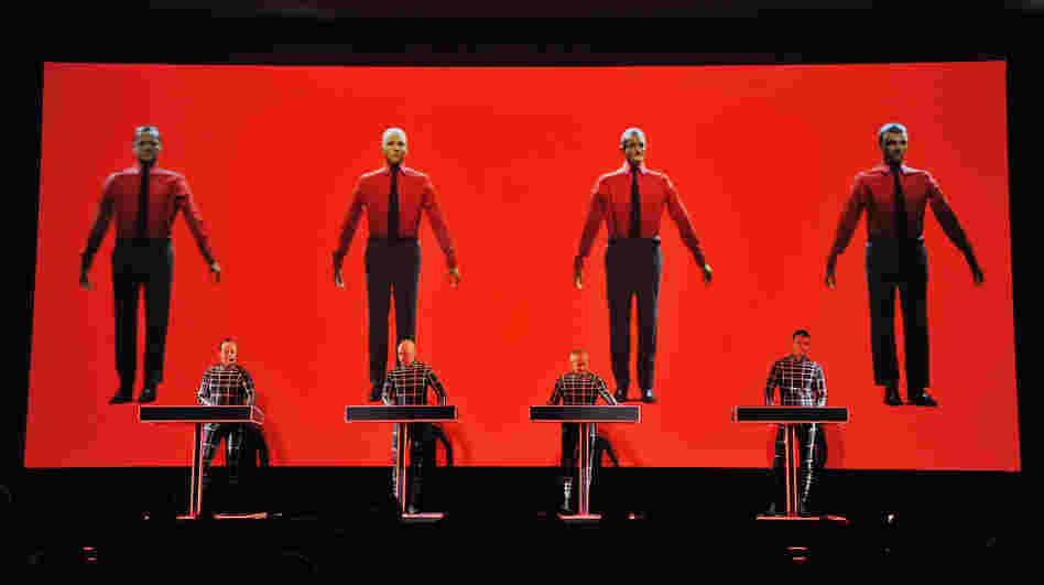 Robots: Ralf Hutter, Henning Schmitz, Fritz Hilpert, and Stefan Pfaffe of the band Kraftwerk perform during the Kraftwerk — Retrospective 1 2 3 4 5 6 7 8 at The Museum of Modern Art on April 10, 2012 in New York City.