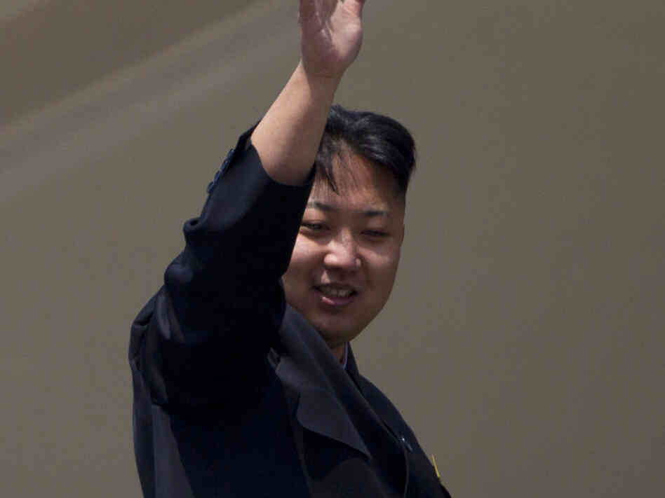 North Korean leader Kim Jong-un waves from a balcony at the end of a mass military parade in Pyongyang's Kim Il Sung Square. Sunday, April 15, 2012. AP Photo/David Guttenfelder)
