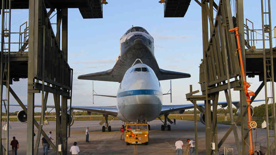 The space shuttle Discovery is loaded onto the back of a modified 747 at Kennedy Space Center on April 15. The plane will ferry the shuttle to Washington, D.C., on April 17, where it will be permanently installed at the Smithsonian National Air and Space Museum. The space shuttle Discovery is loaded onto the back of a modified 747 at Kennedy Space Center on April 15. The plane will ferry the shuttle to Washington, D.C., on April 17, where it will be permanently installed at the Smithsonian National Air and Space Museum.
