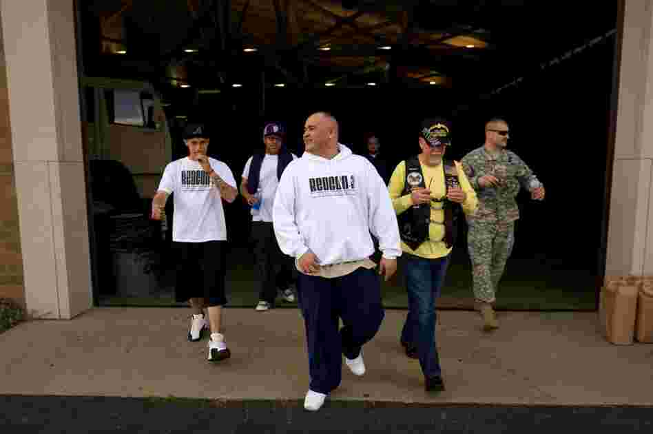 Barillaro (center) leaves the armory after a sound check for his evening hip-hop performance. The 35-year-old comes from a military family; he says he has wanted to be a soldier since he was 12 years old. While in Iraq, he led convoys for the Army.