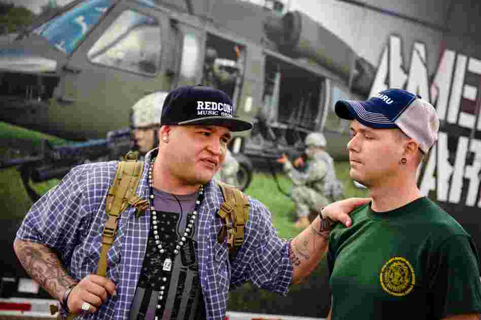 Barillaro comforts Keith Briggs of Louisville, Ky., before the start of the show. Briggs, a fellow veteran who served twice in Iraq and also suffers from PTSD, says he was on the verge of suicide, when he discovered Barillaro's music. Since then, Briggs follows Soldier Hard on tour and chats with him almost daily. "Hopefully, he will play at my wedding," says Briggs.