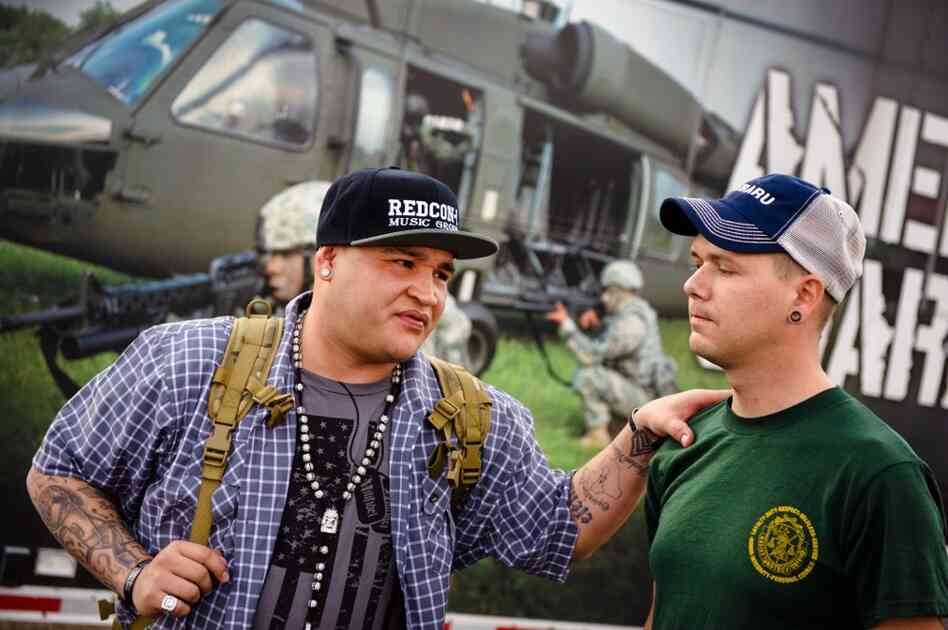Barillaro comforts Keith Briggs of Louisville, Ky., before the start of the show. Briggs, a fellow veteran who served twice in Iraq and also suffers from PTSD, says he was on the verge of suicide, when he discovered Barillaro's music. Since then, Briggs follows Soldier Hard on tour and chats with him almost daily. "Hopefully, he will play at my wedding," says Briggs.