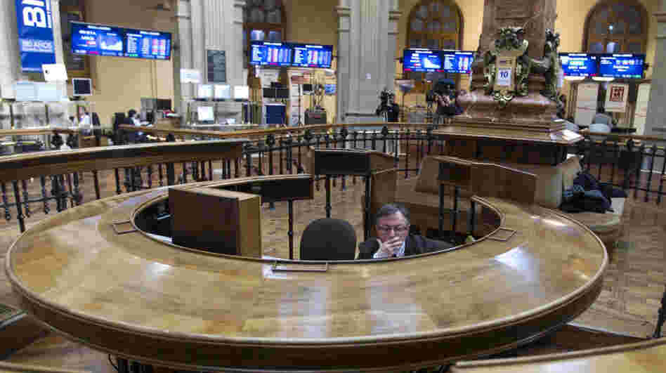 A broker sits in the stock exchange in Madrid. Worries about Spain's finances intensified last week as the country's bond yields rose on international markets, making it more expensive for Spain to borrow money. A broker sits in the stock exchange in Madrid. Worries about Spain's finances intensified last week as the country's bond yields rose on international markets, making it more expensive for Spain to borrow money.
