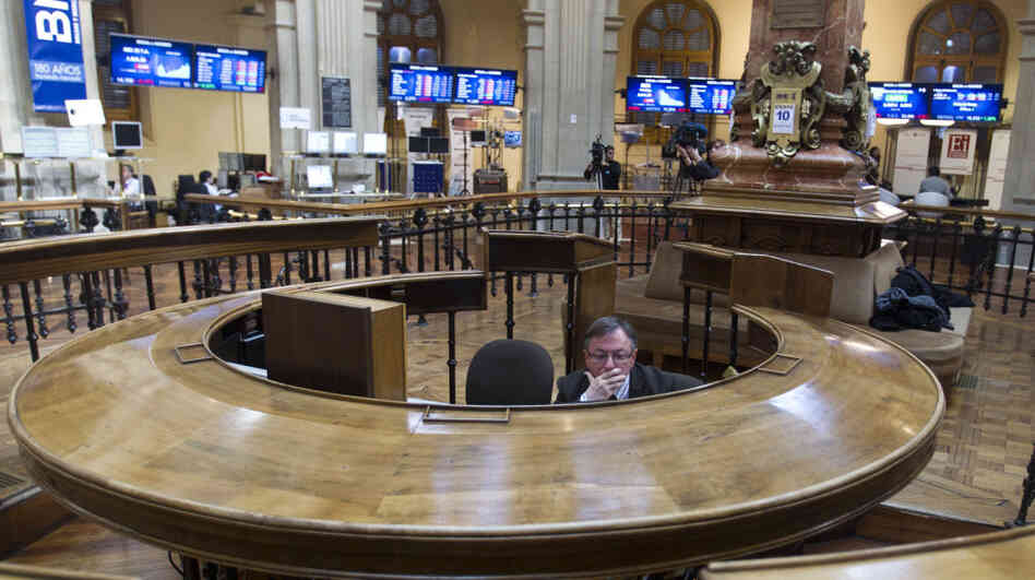 A broker sits in the stock exchange in Madrid. Worries about Spain's finances intensified last week as the country's bond yields rose on international markets, making it more expensive for Spain to borrow money. A broker sits in the stock exchange in Madrid. Worries about Spain's finances intensified last week as the country's bond yields rose on international markets, making it more expensive for Spain to borrow money.