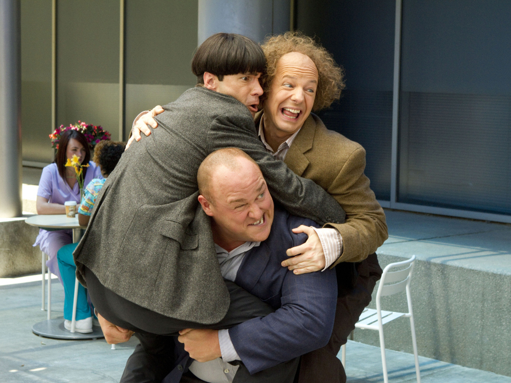 After they leave their orphanage for the first time, Curly (Will Sasso) bears a heavy burden — his fellow Stooges, Moe (Chris Diamantopoulos, left) and Larry (Sean Hayes).