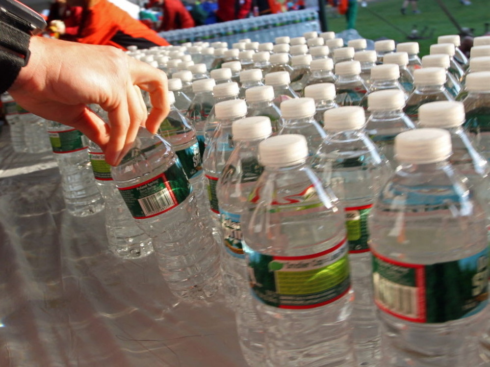 Before the start of the Boston Marathon this morning, a runner grabbed a bottle of water from among the hundreds lined up on a table in Hopkinton, Mass.