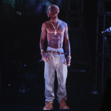 Rapper Snoop Dogg and a digital recreation of deceased rapper Tupac Shakur perform onstage at the Coachella Festival.
