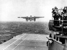 U.S. Navy crewmen watch a B-25 bomber take off from the USS Hornet for the Doolittle Raid on Tokyo on April 18, 1942. U.S. Navy crewmen watch a B-25 bomber take off from the USS Hornet for the Doolittle Raid on Tokyo on April 18, 1942.